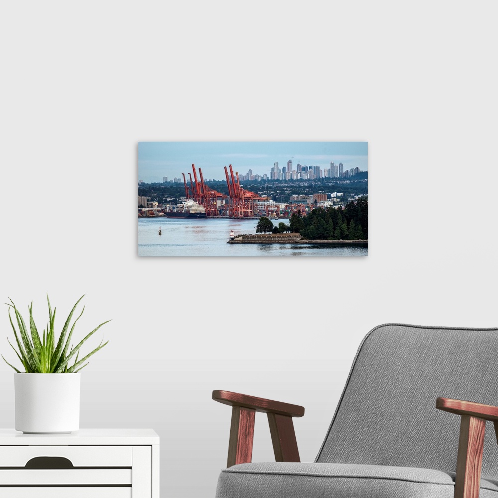 A modern room featuring View of Vancouver harbor with Metrotown in the background, Vancouver, British Columbia, Canada.