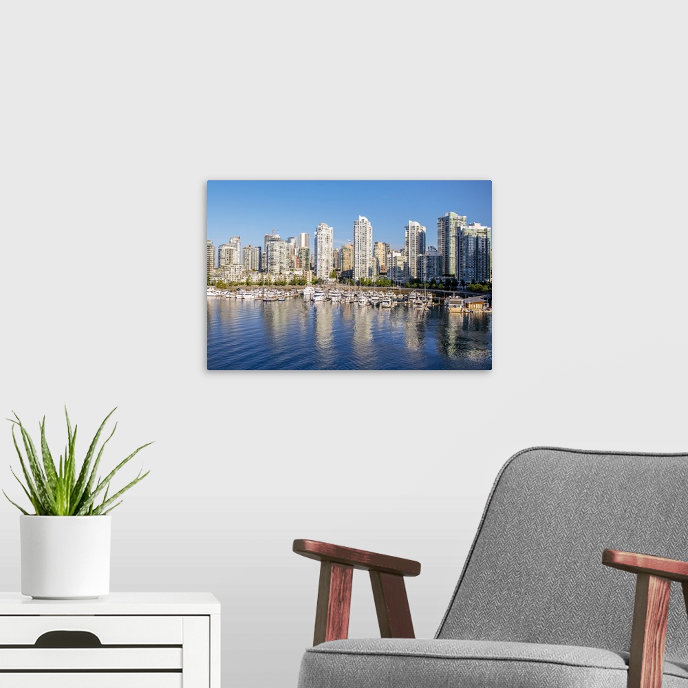 A modern room featuring Photograph of part of the Vancouver, British Columbia skyline with False Creek Harbor and boats i...