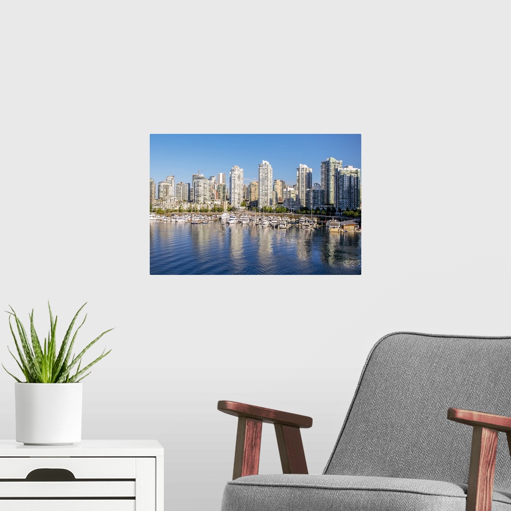A modern room featuring Photograph of part of the Vancouver, British Columbia skyline with False Creek Harbor and boats i...