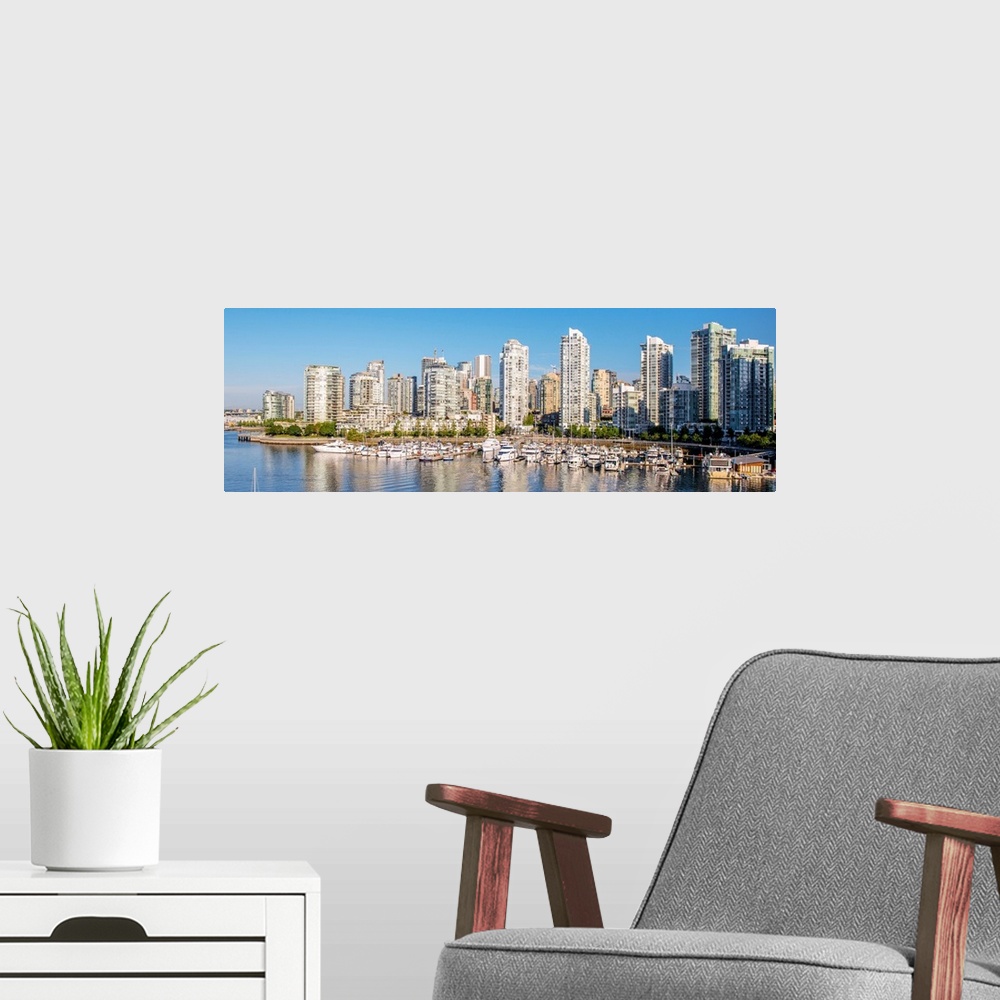 A modern room featuring Panoramic photograph of part of the Vancouver, British Columbia skyline with False Creek Harbor a...