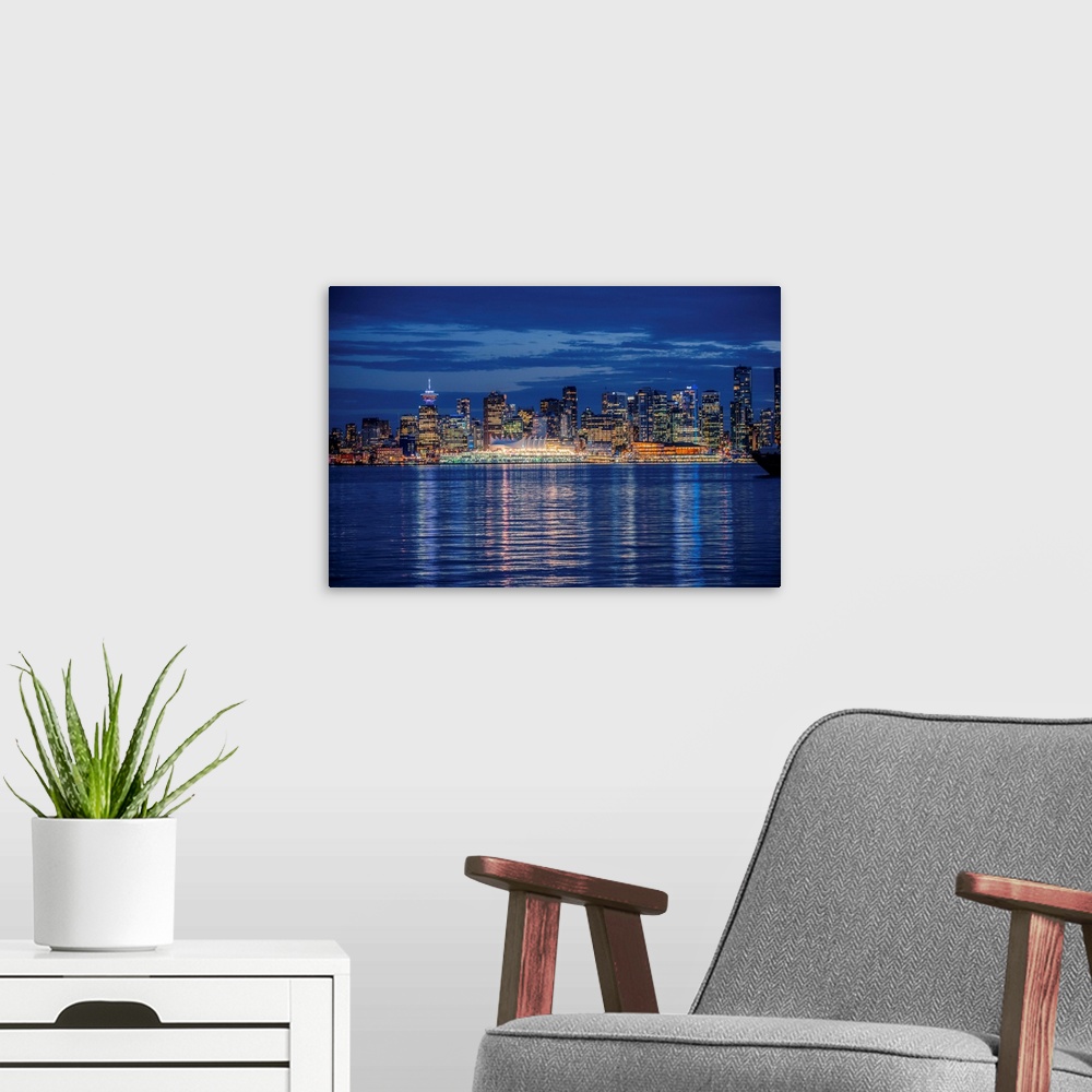 A modern room featuring View of Vancouver skyline at night in British Columbia, Canada.