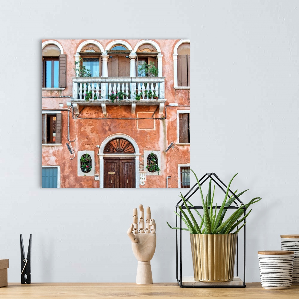 A bohemian room featuring Square photograph of an Italian facade in Venice with a door, windows, and a balcony.