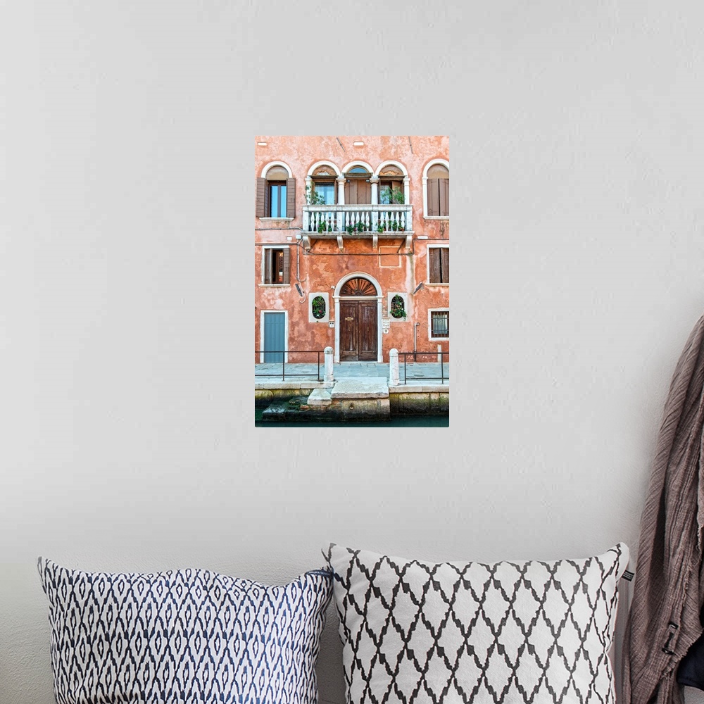 A bohemian room featuring Photograph of a salmon colored facade in Venice with a door, windows, and a balcony.