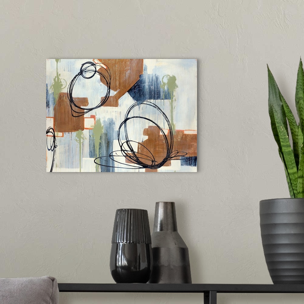 A modern room featuring Abstract painting of circles and various other shapes on canvas.