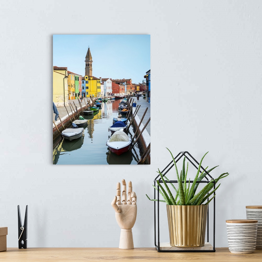 A bohemian room featuring Photograph of docked gondolas in a small canal in the Venetian Lagoon in Burano, Venice, Italy wi...