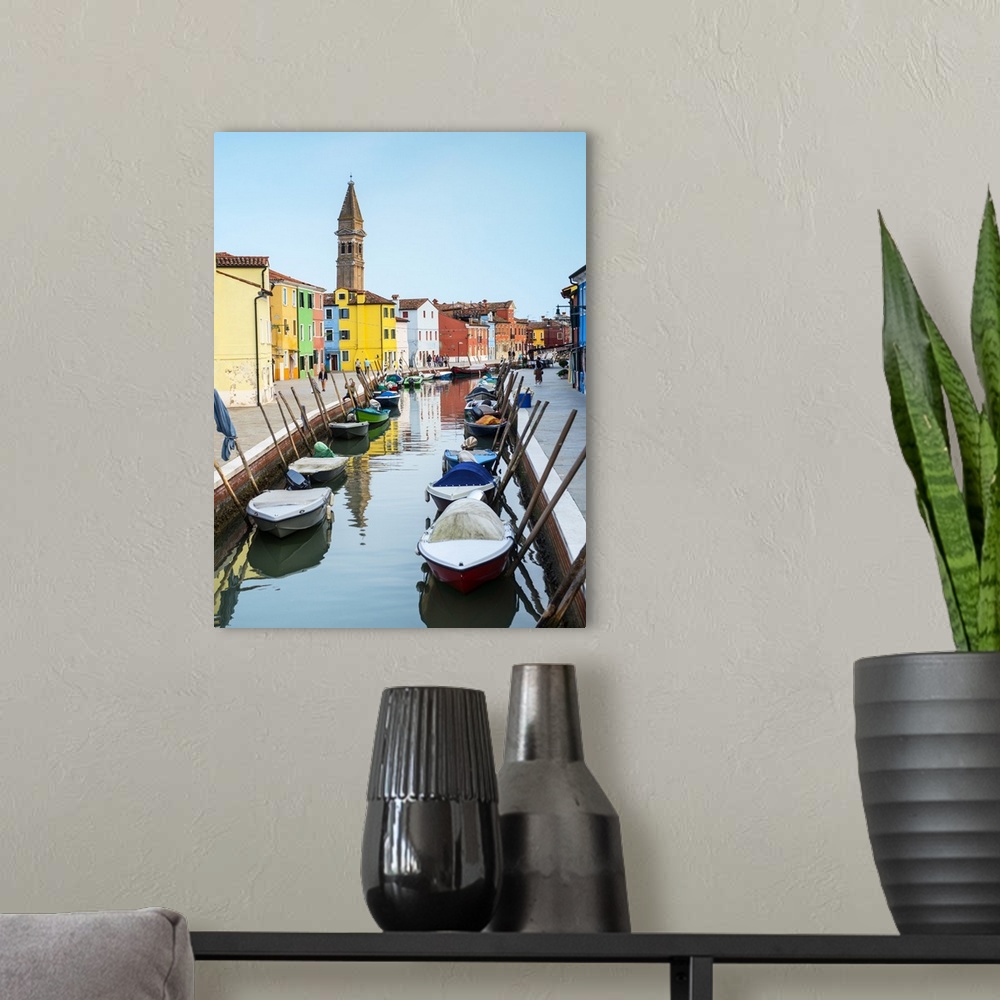 A modern room featuring Photograph of docked gondolas in a small canal in the Venetian Lagoon in Burano, Venice, Italy wi...