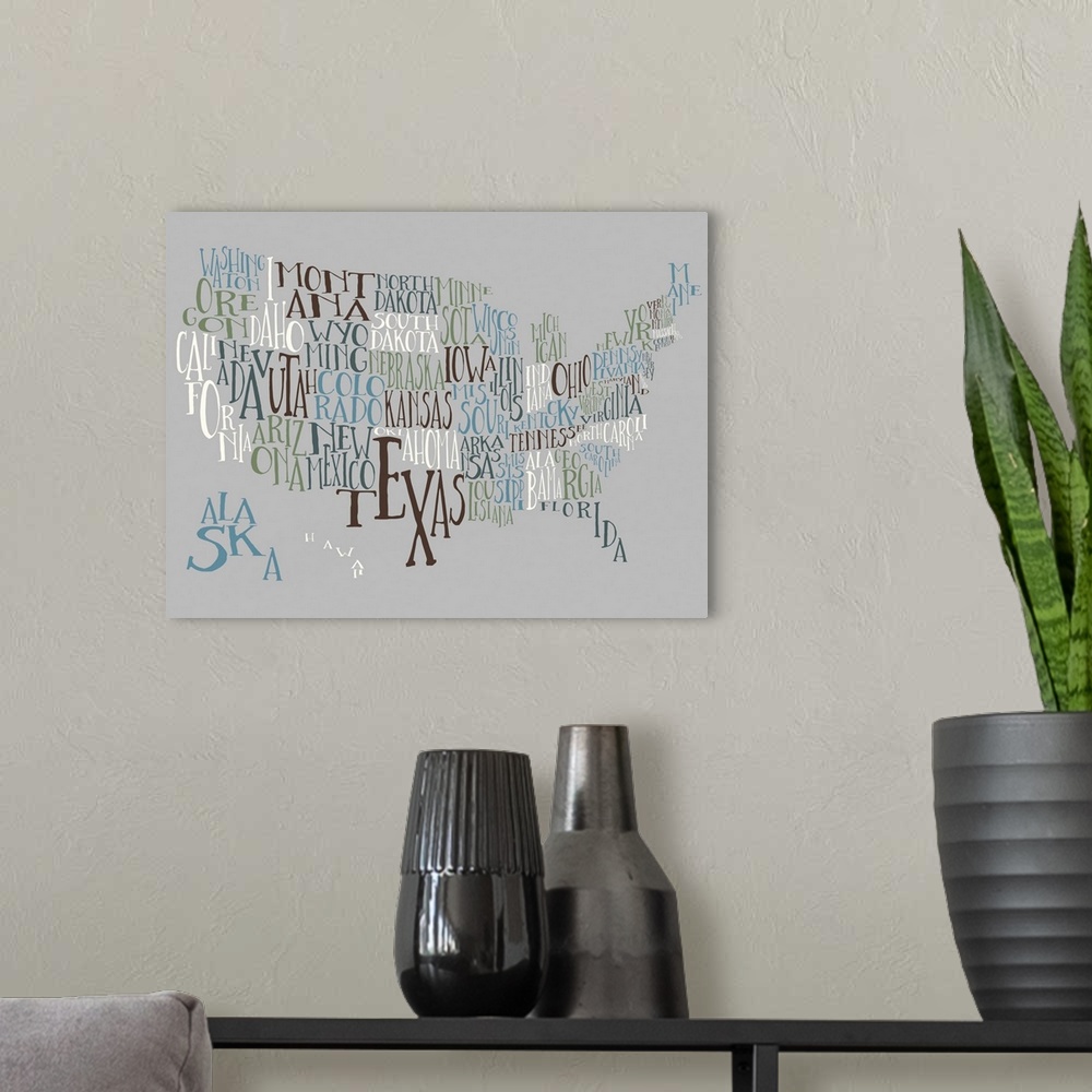 A modern room featuring A hand-drawn typography map of the United States with all the state names, in white, blue, and bl...