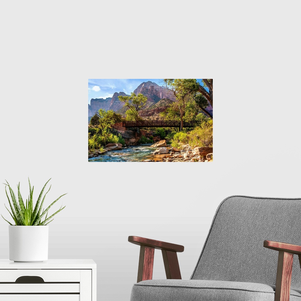 A modern room featuring Landscape photograph of a pedestrian bridge over the Virgin River at Zion National Park, UT.