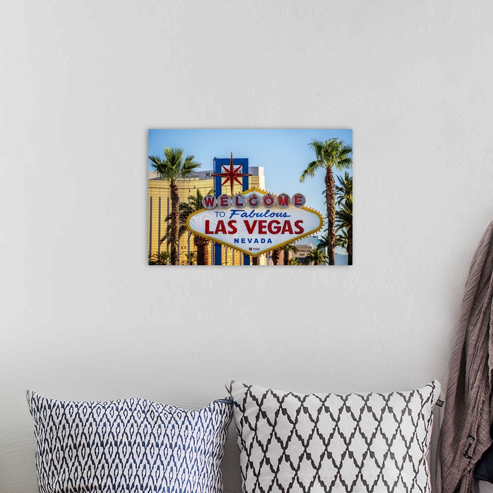 A bohemian room featuring Photograph of the Welcome to Fabulous Las Vegas Nevada sign with palm trees in the background.