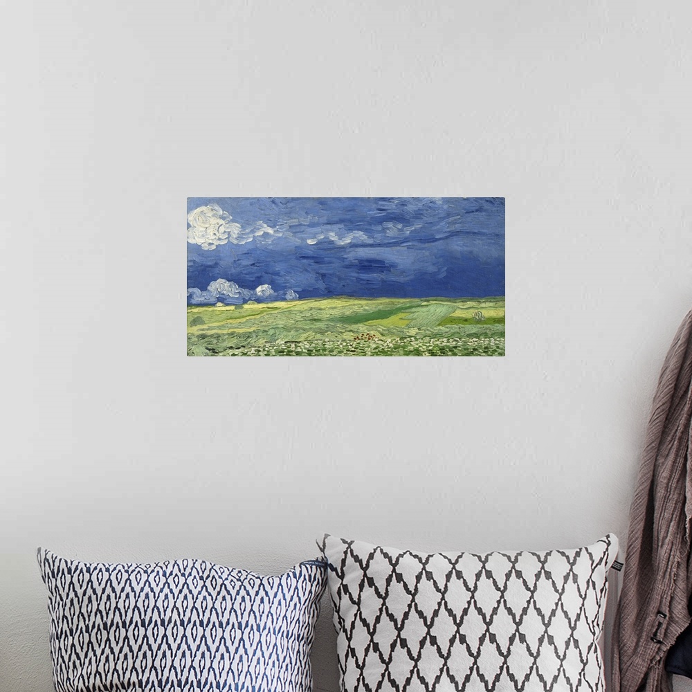 A bohemian room featuring Vincent van Gogh - Wheatfield under thunderclouds.
