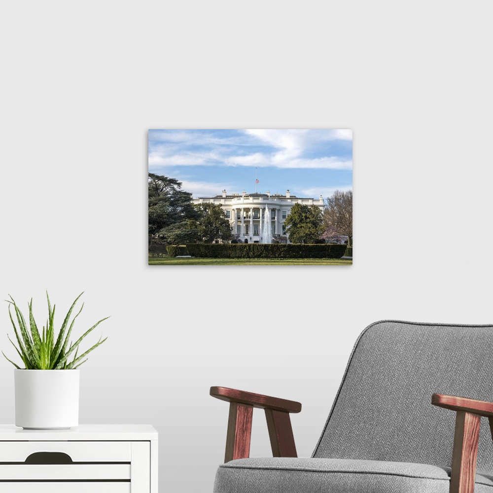 A modern room featuring The White House, fountain, and lawn in Washington, DC.