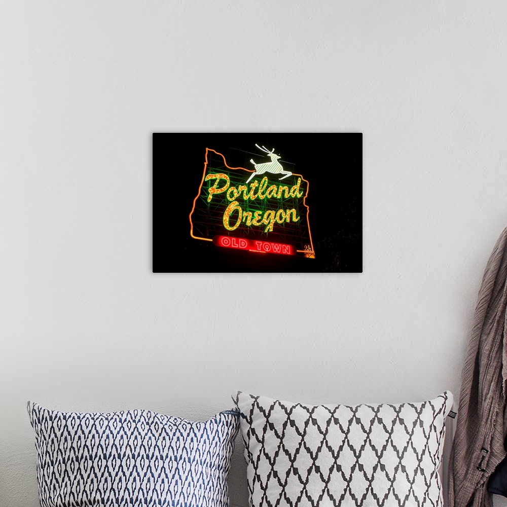 A bohemian room featuring The White Stag sign, also known as the "Portland Oregon" sign, is a lighted neon-and-incandescent...