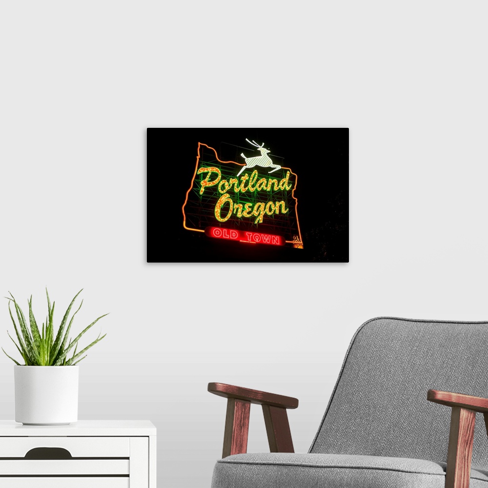 A modern room featuring The White Stag sign, also known as the "Portland Oregon" sign, is a lighted neon-and-incandescent...