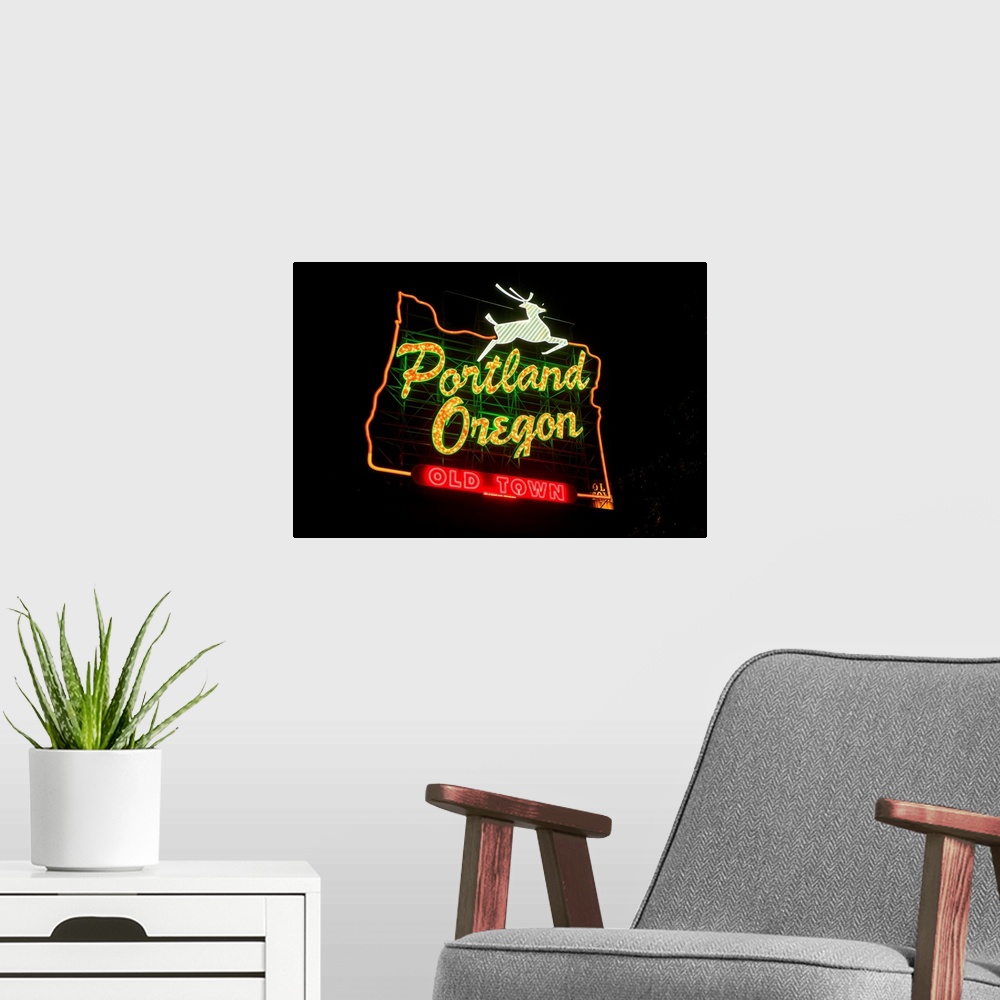 A modern room featuring The White Stag sign, also known as the "Portland Oregon" sign, is a lighted neon-and-incandescent...