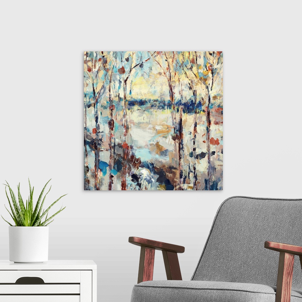 A modern room featuring A dramatic abstract painting of a path through a forest on square shaped wall art.