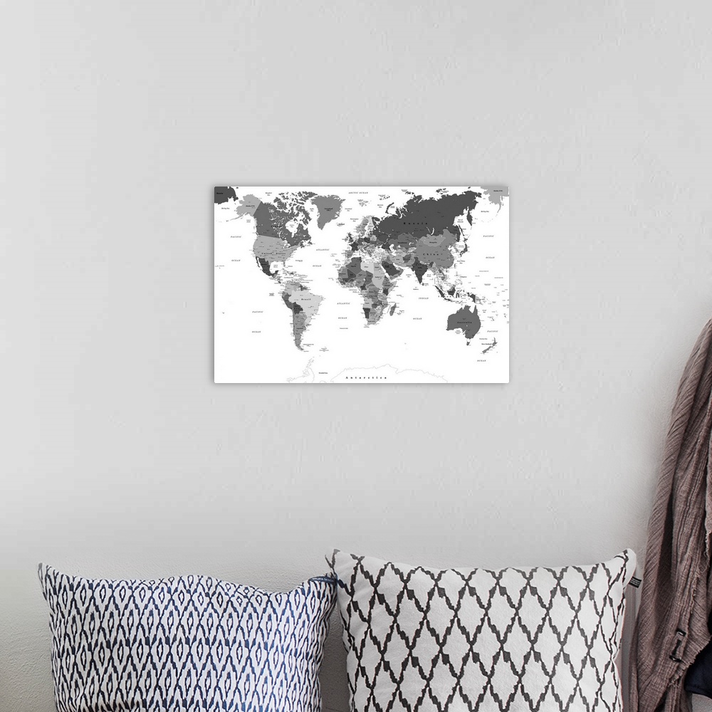 A bohemian room featuring Large black and white map of the World with a classic font.