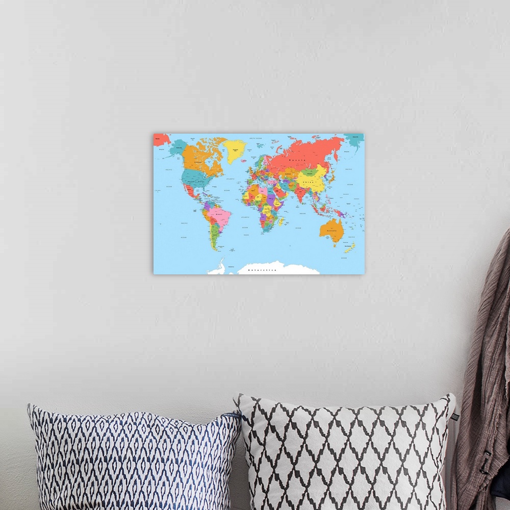 A bohemian room featuring Large color map of the World with a modern font.