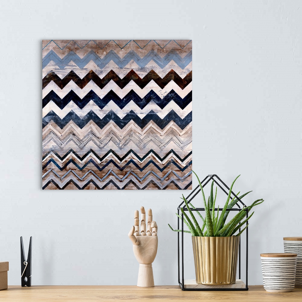 A bohemian room featuring Abstract contemporary painting of a triangular pattern done in neutral earth tones on a square ca...
