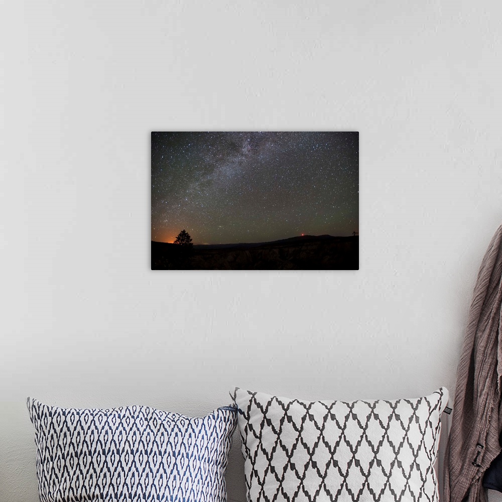 A bohemian room featuring Silhouette photograph of Zion National Park at night time with a starry sky above.