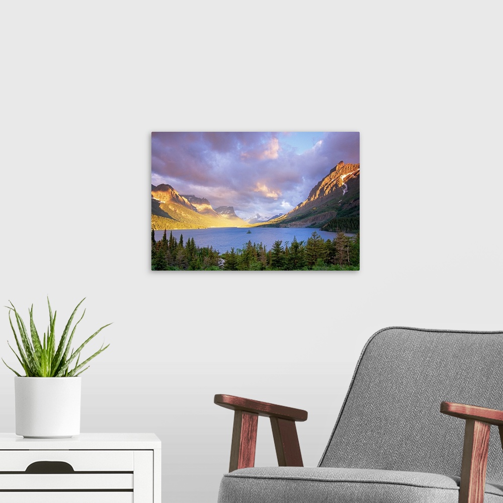 A modern room featuring From the National Geographic Collection.  Photograph of lake lined with mountains with forest in ...