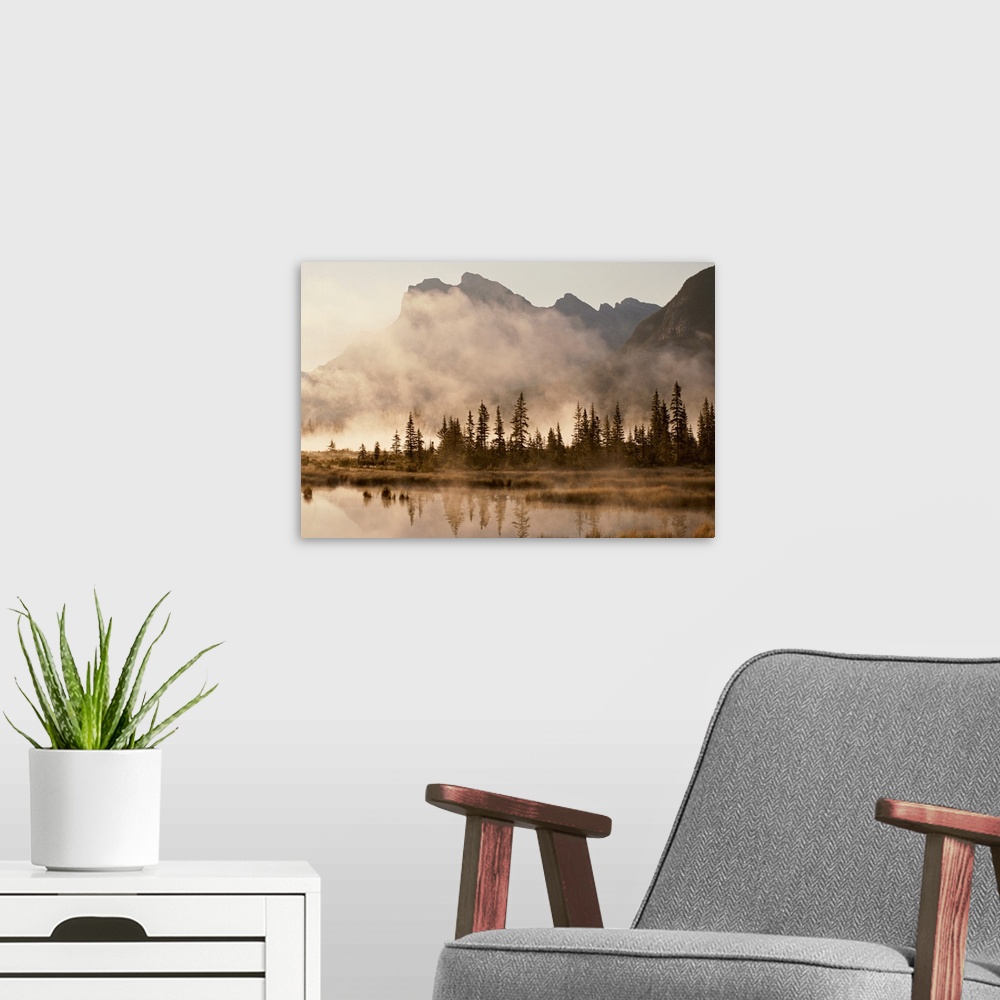 A modern room featuring Foggy sunrise over the Vermilion Lakes.