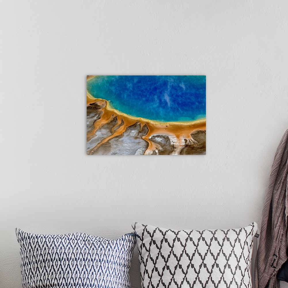 A bohemian room featuring Large image print of a spring  at Yellowstone National Park viewed from above.
