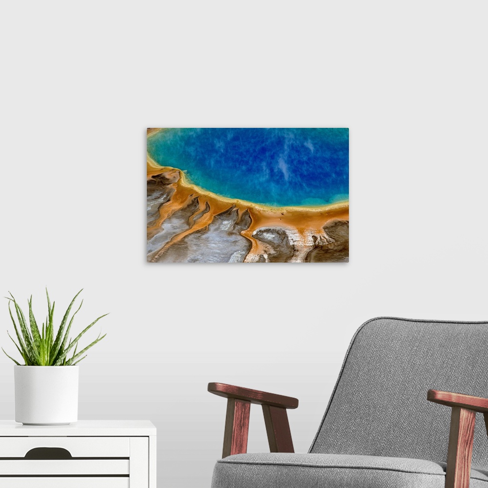 A modern room featuring Large image print of a spring  at Yellowstone National Park viewed from above.