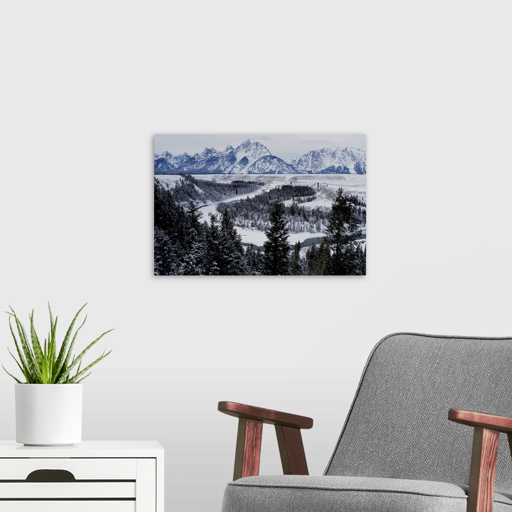 A modern room featuring Winter view of the Snake River, Grand Teton National Park.