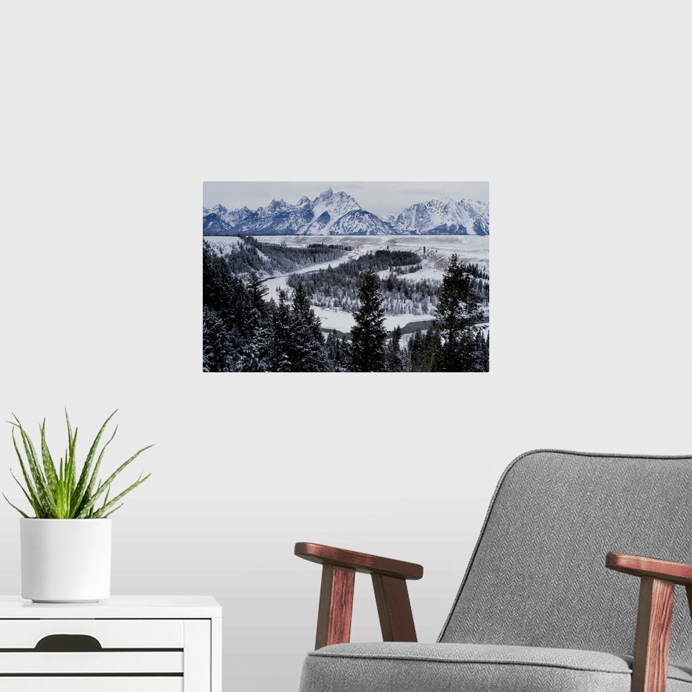 A modern room featuring Winter view of the Snake River, Grand Teton National Park.