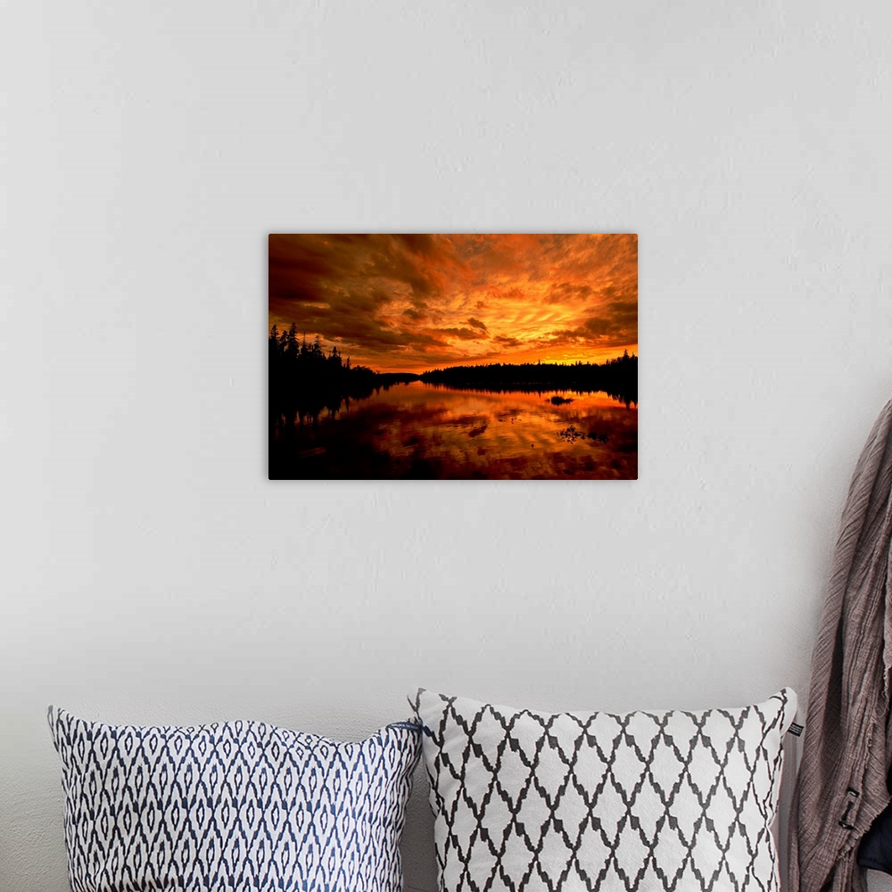 A bohemian room featuring Horizontal photograph from the National Geographic Collection of a golden sunset over a lake, und...