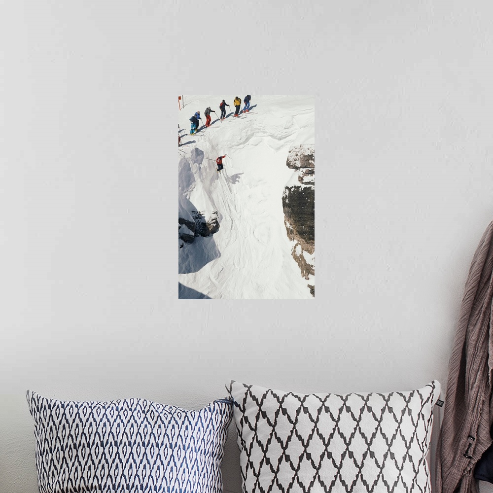 A bohemian room featuring Skilled skiers plunge more than 15 feet in Corbet's Couloir.