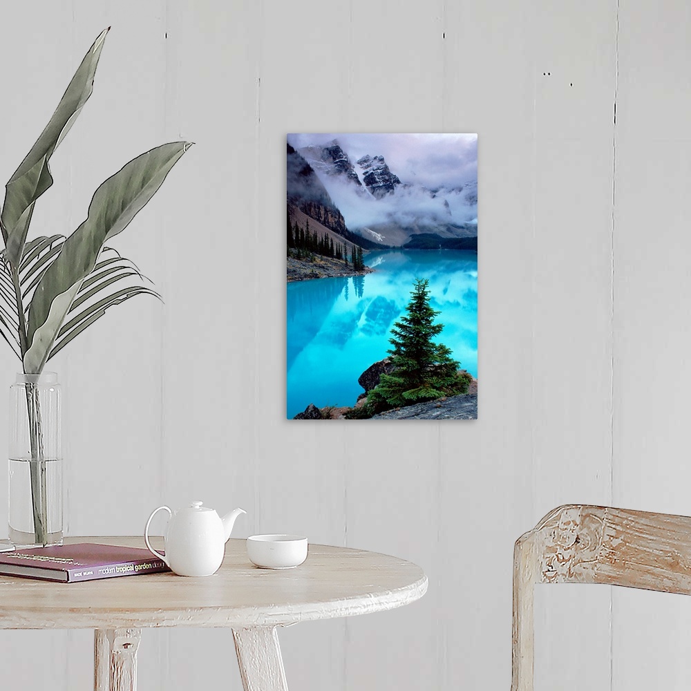 A farmhouse room featuring From the National Geographic Collection a photograph of mountains reflecting in water as clouds p...