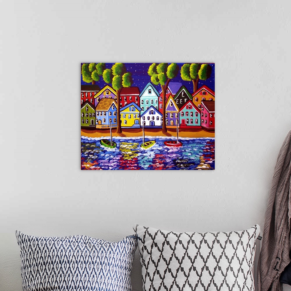 A bohemian room featuring Colorful shoreline with houses reflected in the water.