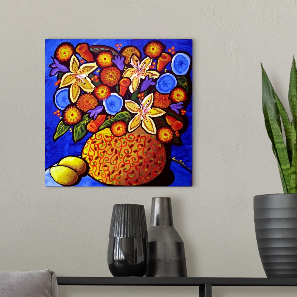 A modern room featuring Colorful, whimsical fall bouquet in a vase with lemons on the side.