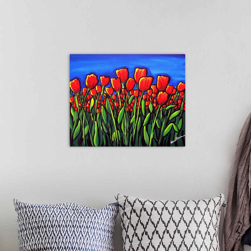 A bohemian room featuring Vibrant red tulips contrasted against a deep blue sky.
