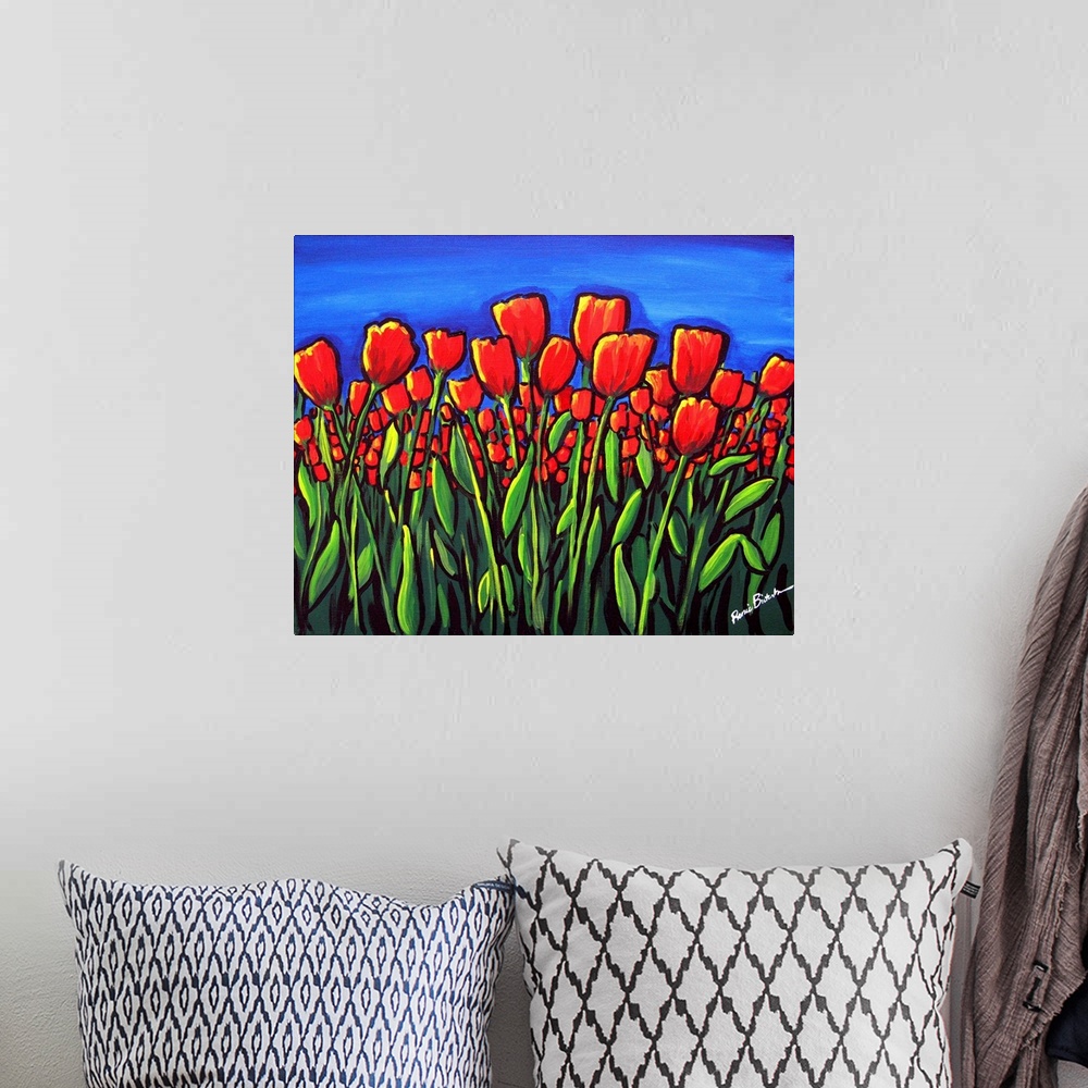A bohemian room featuring Vibrant red tulips contrasted against a deep blue sky.