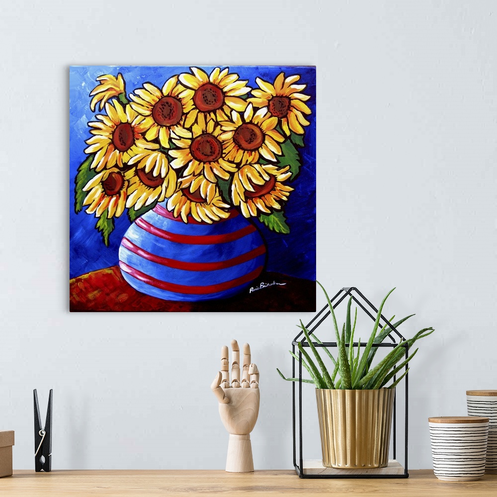 A bohemian room featuring Colorful, whimsical sunflowers in striped vase.