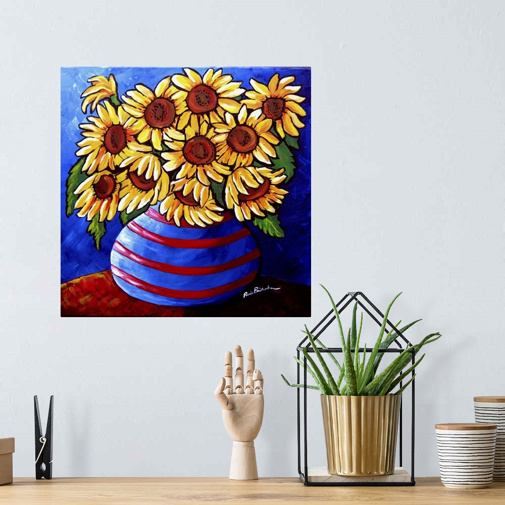 A bohemian room featuring Colorful, whimsical sunflowers in striped vase.