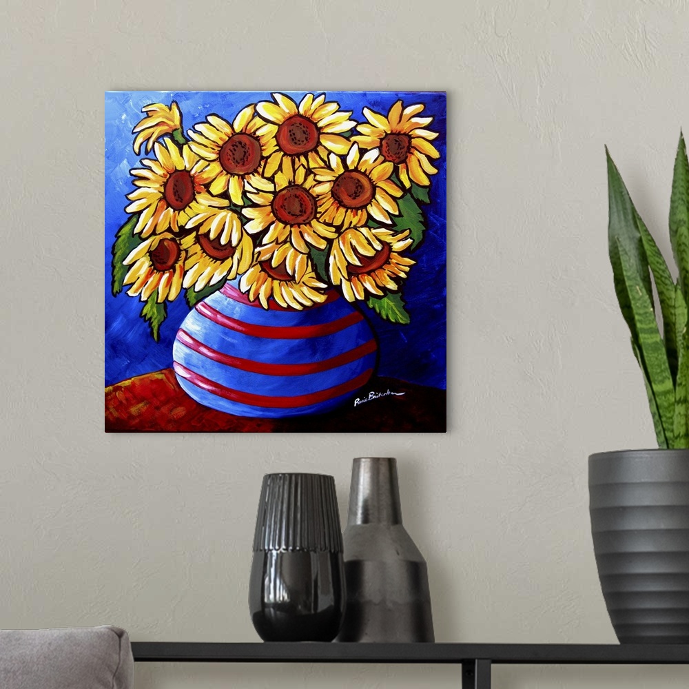 A modern room featuring Colorful, whimsical sunflowers in striped vase.