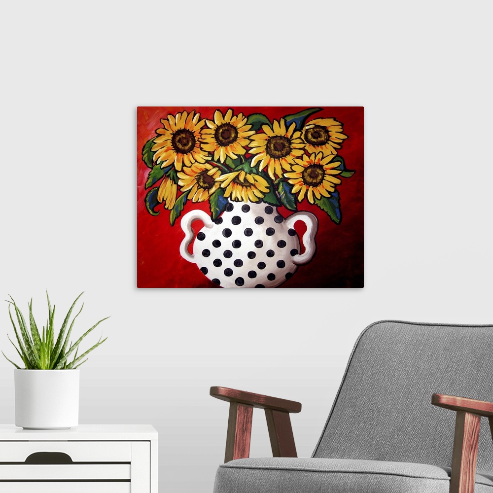 A modern room featuring Whimsical flavor with brightly colored sunflowers in a black and white vase.