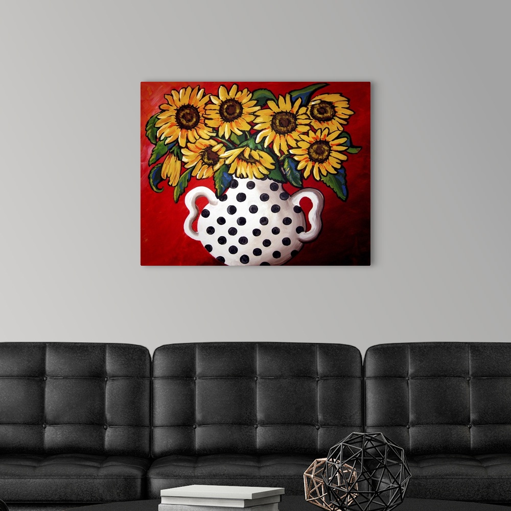 A modern room featuring Whimsical flavor with brightly colored sunflowers in a black and white vase.