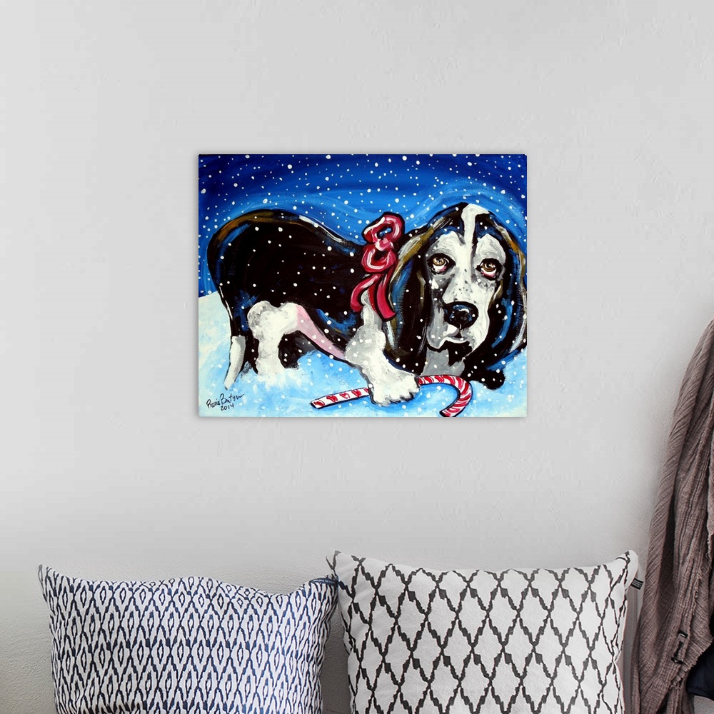 A bohemian room featuring A Basset Hound in the snow with a candy cane.