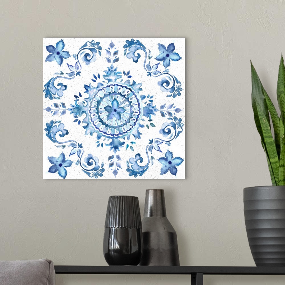 A modern room featuring A watercolor painting of a floral medallion design in blue and white.