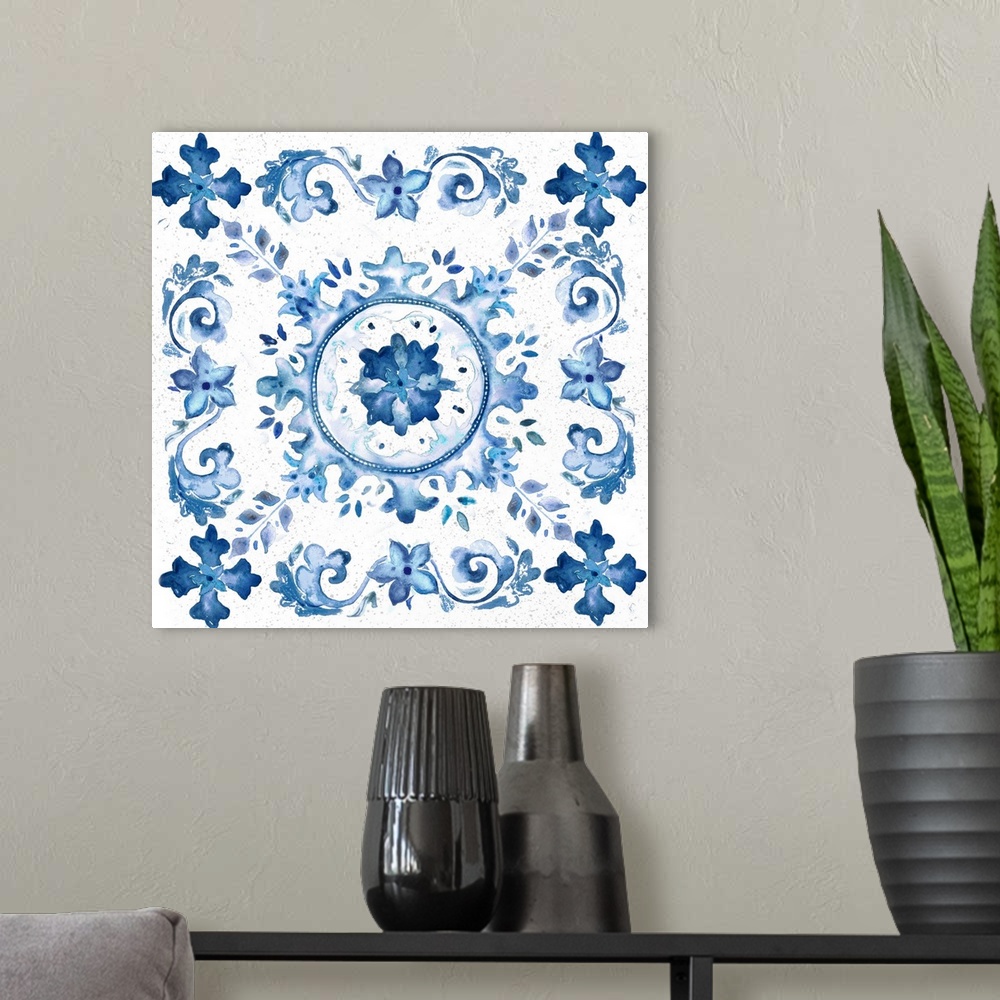 A modern room featuring A watercolor painting of a floral medallion design in blue and white.