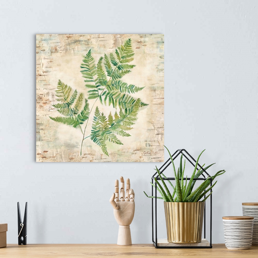 A bohemian room featuring Decorative artwork of a fern leaf against a wood bark texture with a brown border.