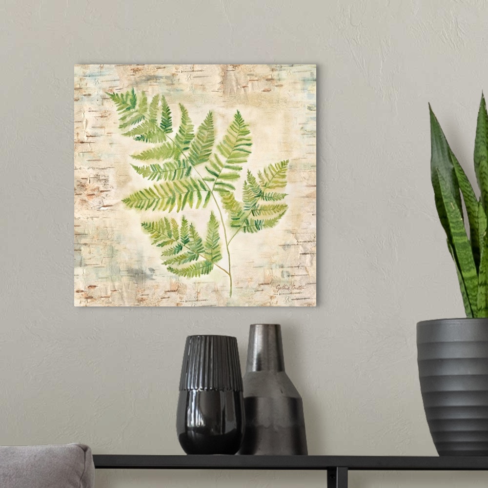 A modern room featuring Decorative artwork of a fern leaf against a wood bark texture with a brown border.