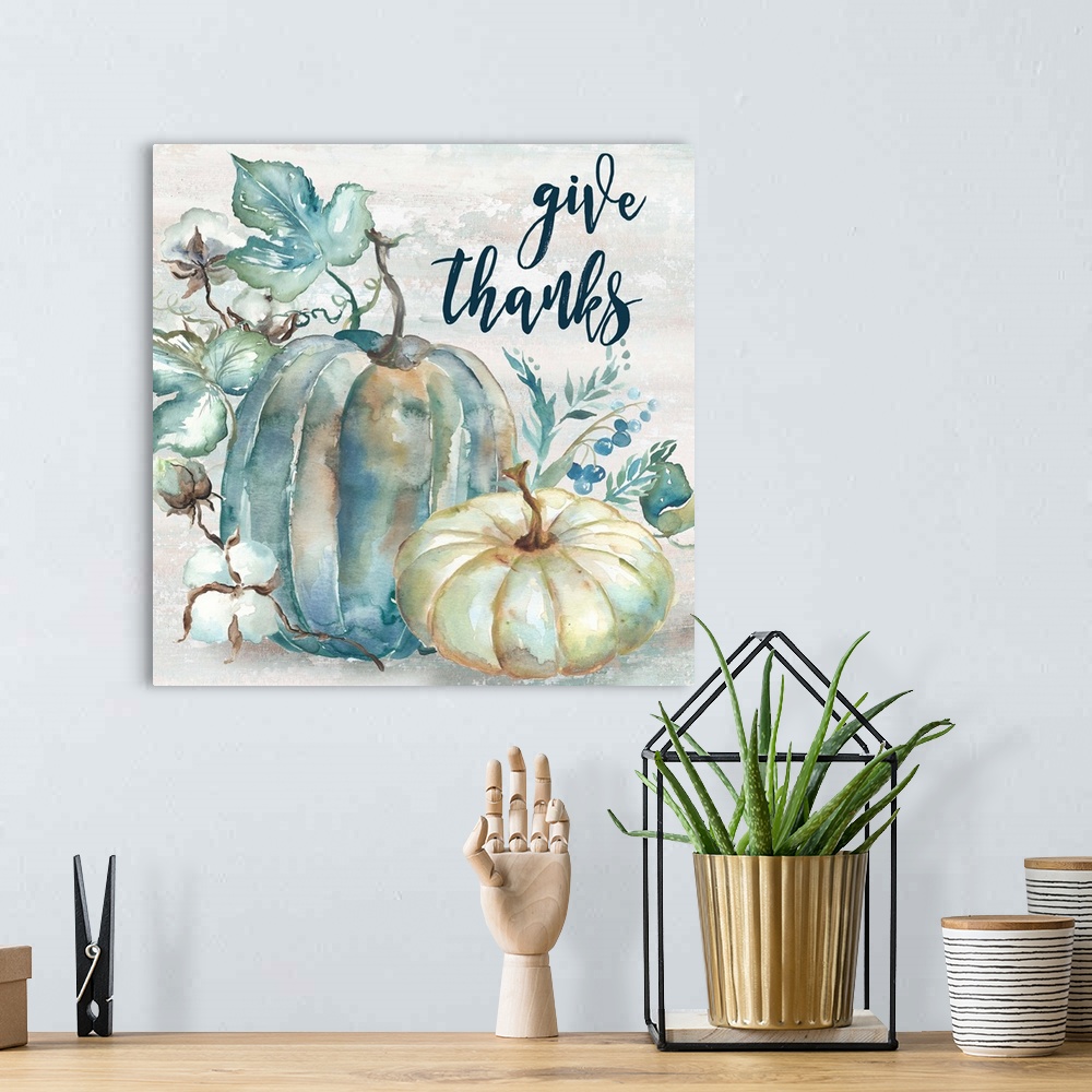 A bohemian room featuring "Give Thanks" on a watercolor painting of a group of pumpkins with autumn leaves in cool shades o...
