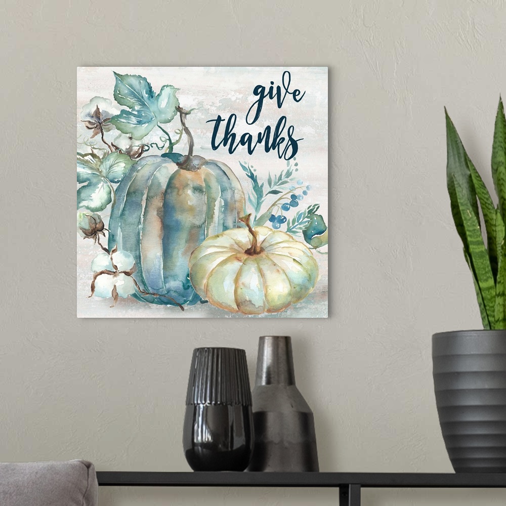 A modern room featuring "Give Thanks" on a watercolor painting of a group of pumpkins with autumn leaves in cool shades o...