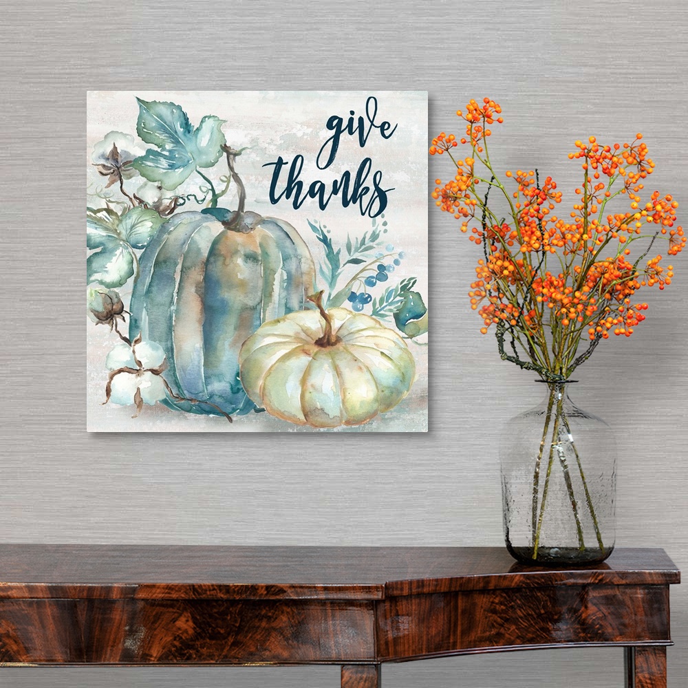 A traditional room featuring "Give Thanks" on a watercolor painting of a group of pumpkins with autumn leaves in cool shades o...