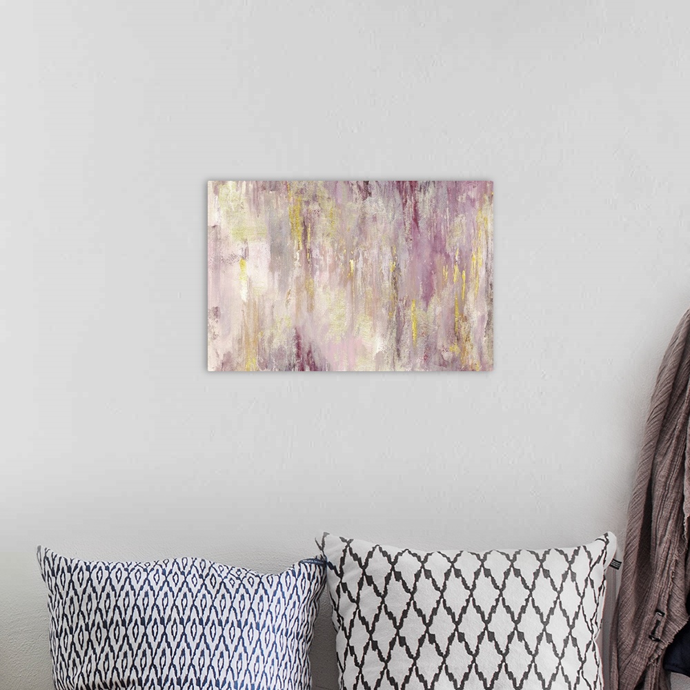 A bohemian room featuring Horizontal abstract painting with shades of pink and yellow.